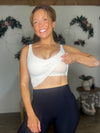 Holding Up Padded Workout Tank