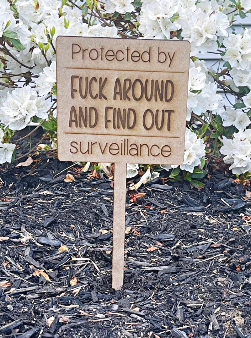 Protected By Wood Sign